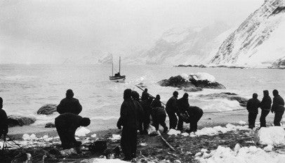 Loading the James Caird with shingles and boulders for ballast