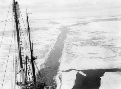 Mast of the Endurance with the wake of the ship through a field of young ice