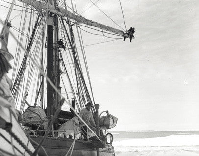 Frank Hurley aloft, Ernest Shackleton on the deck of the Endurance