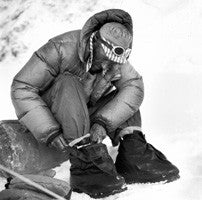 Hillary putting on his specially designed high altitude boot