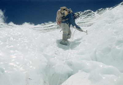 Tenzing wearing crampons climbing down an icy patch on the Lhotse Face