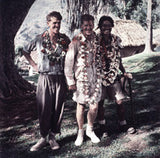 Hillary, Hunt and Tenzing Norgay wearing garlands of flowers