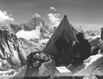 Sherpa drinking tea with Ama Dablam in the distance