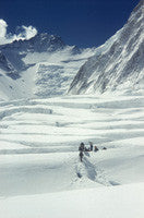 Sherpas crossing the Western Cwm with Lhotse face in the distance