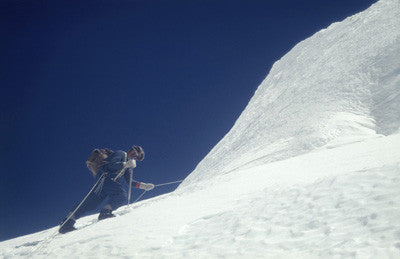 Wilfred Noyce on a rope ascending an ice face in the Khumbu Glacier