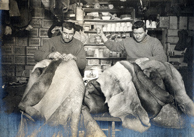 Edgar Evans and Tom Crean mending sleeping bags