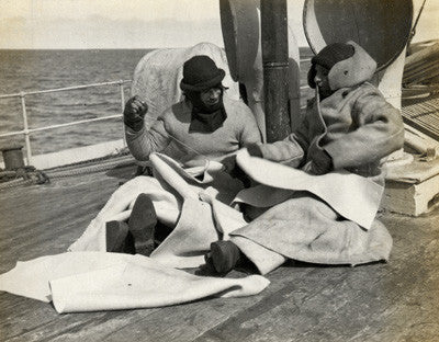 Sailors making clothing on the deck of the Terra Nova
