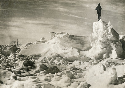Crew member standing on the ice with Endurance in the background