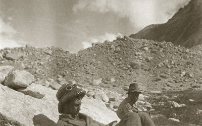 Expedition members resting; George Mallory reading