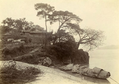 Isabella’s boat moored by a temple on a promontory, Min river
